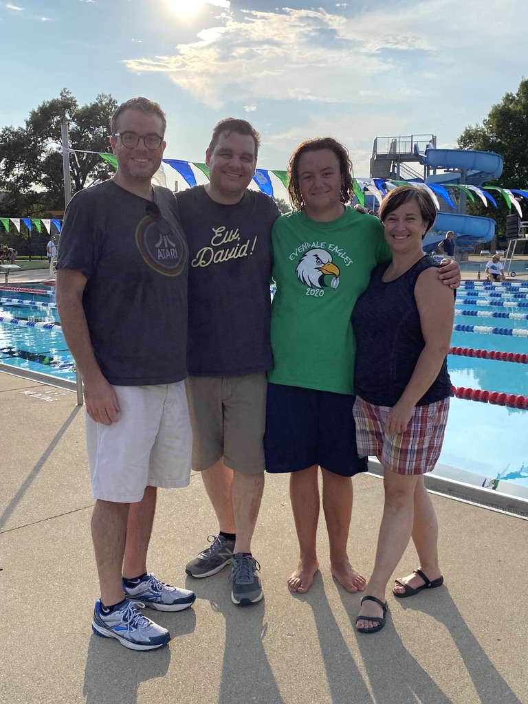 A group of people posing for the camera
Description automatically generated